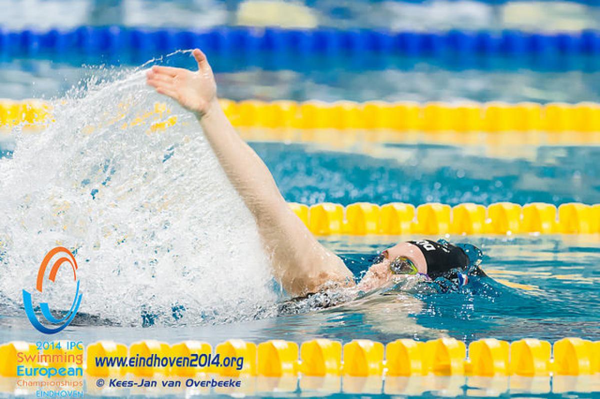 A female swimmer in a race at the 2014 IPC Swimming European Championships.