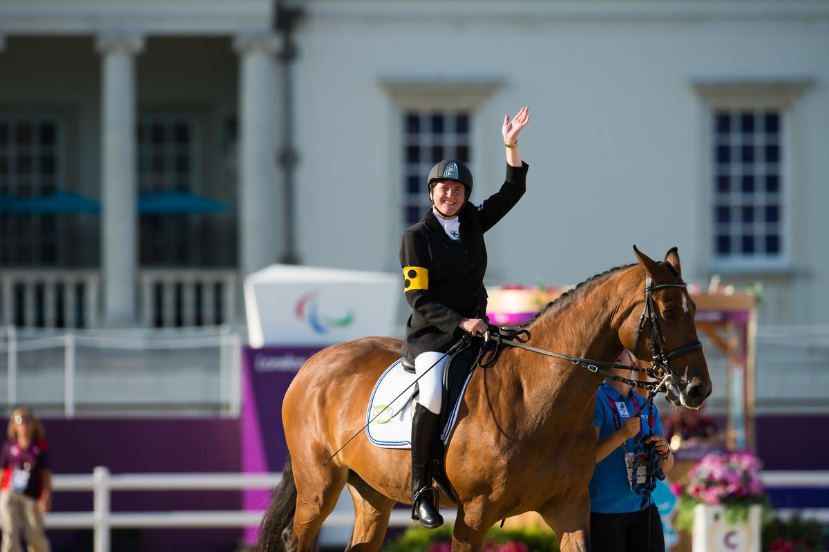 Katja Karjalainen of Finland celebrating her silver medal in the Mixed Dressage - Freestyle grade Ib at the London 2012 Paralympic Games.