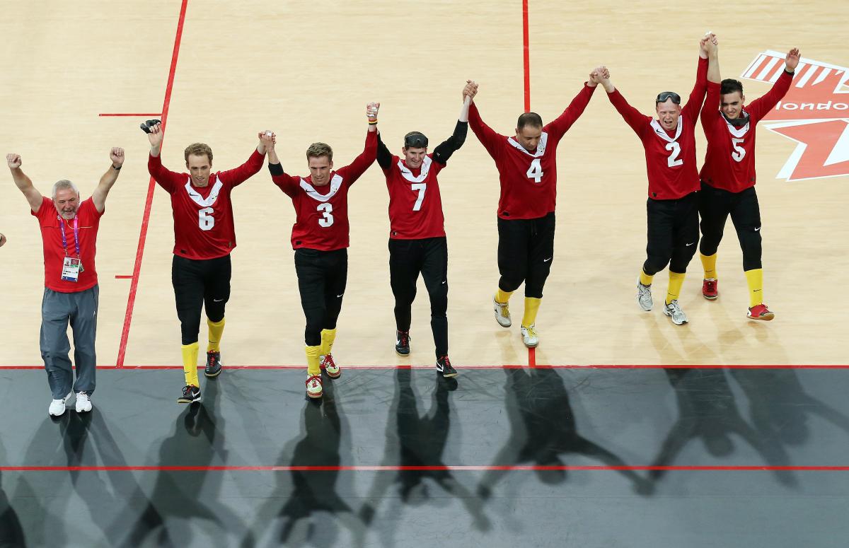 The Belgium team celebrate after their victory during the Men's Group B Goalball match between Belgium and Canada at the London 2012 Paralympic Games