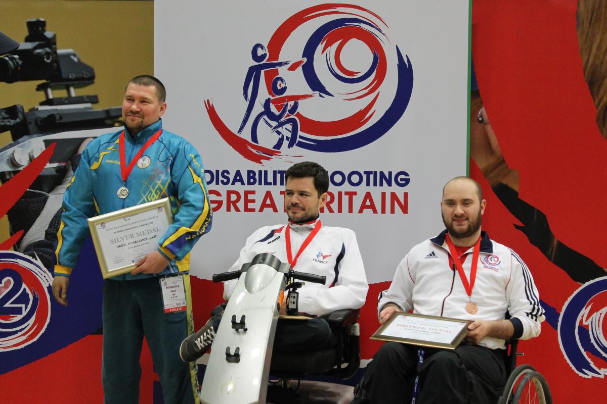 Tanguy De La Forest, Vasyl Kovalchuk and Ryan Cockbill at the 2015 IPC Shooting World Cup in Stoke Mandeville, Great Britain