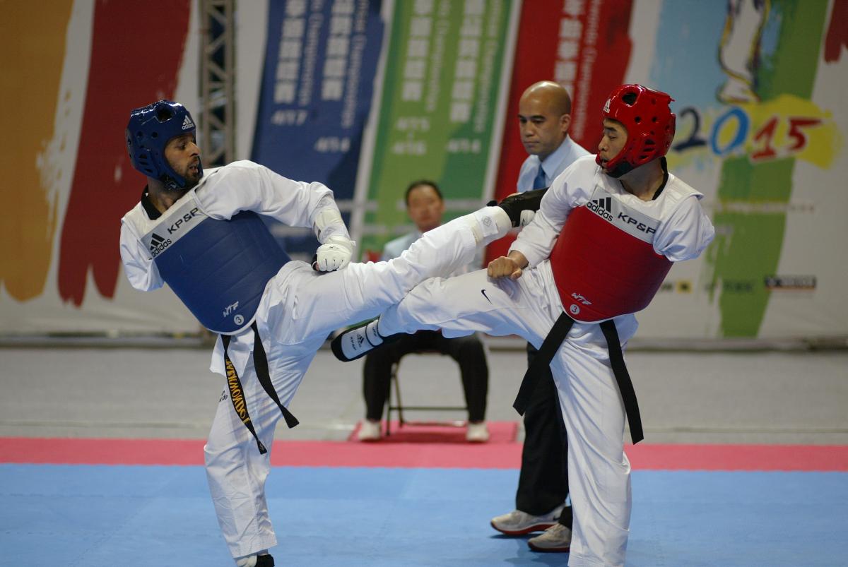 Two athletes performing in taekwondo