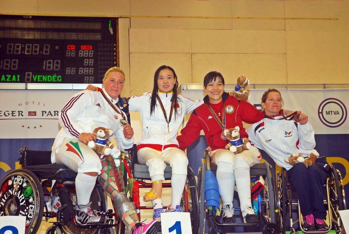 Four athletes at the medal ceremony.