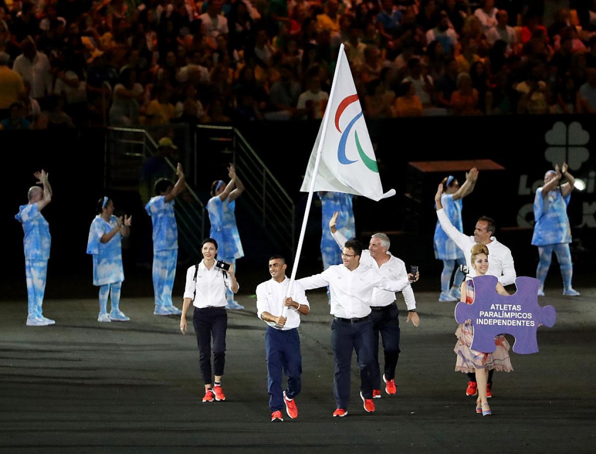 Flag bearer Ibrahim Al Hussein of Syria leads the Independent Paralympic Athletes team entering the stadium during the Opening Ceremony of the Rio 2016 Paralympic Games.