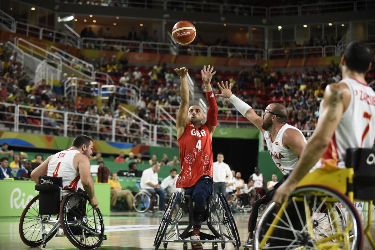 wheelchair basketball male players fight for the ball
