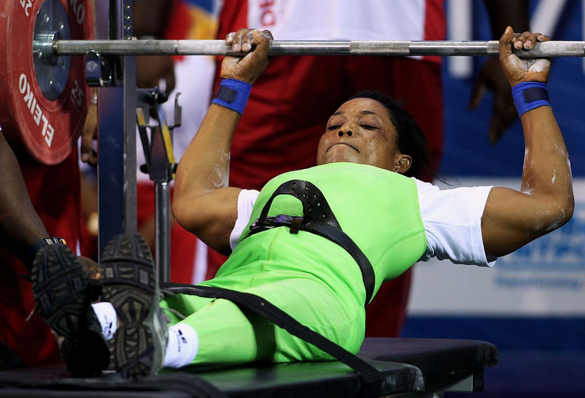 a female powerlifter prepares to lift