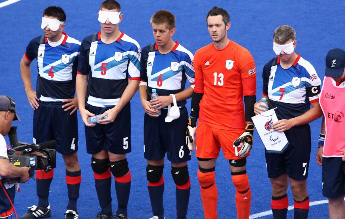 a group of blind football players line up before a match