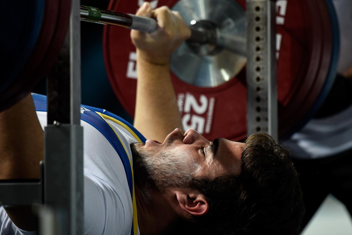 A male powerlifter prepares to lift