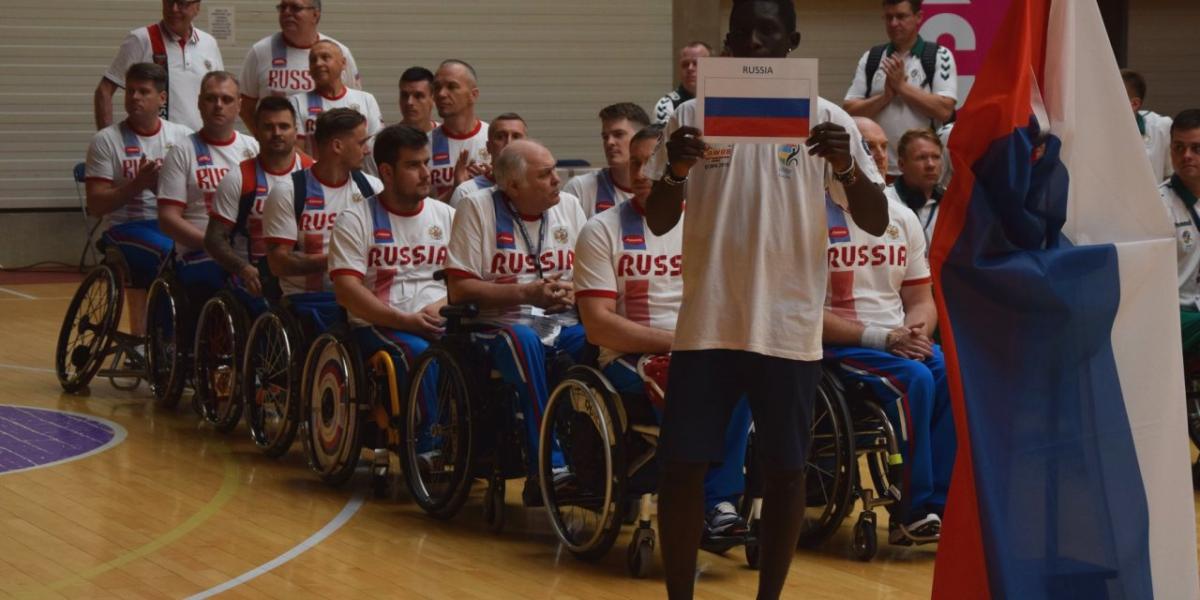 a group of male wheelchair basketball players 