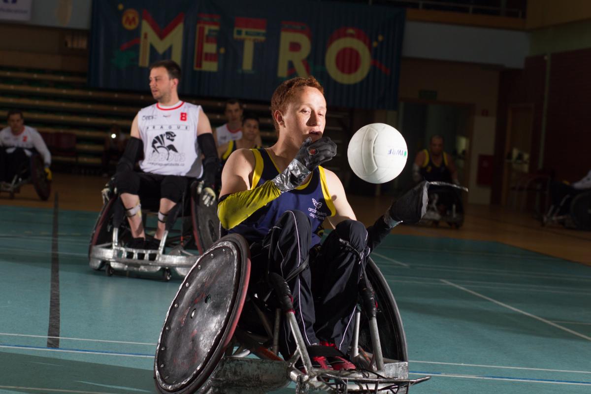 male wheelchair rugby player Carlos Neme with the ball