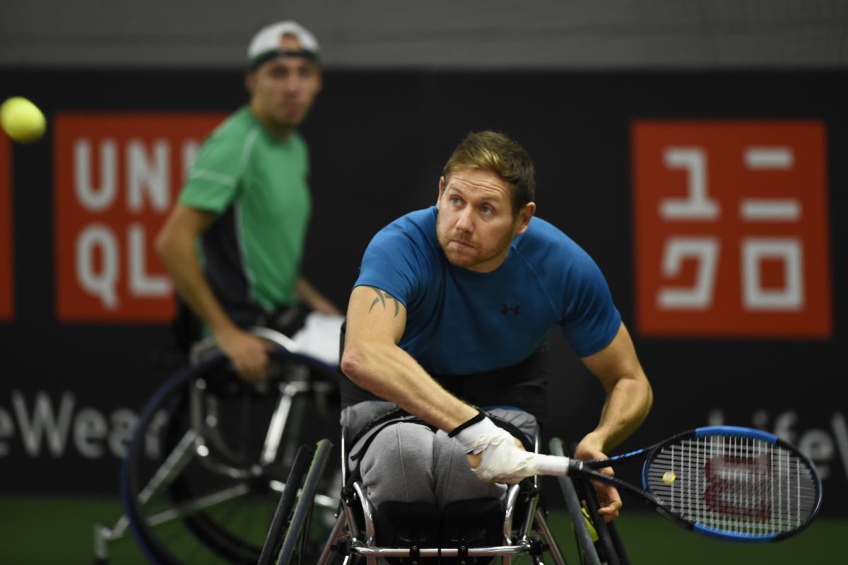 male wheelchair tennis players Antony Cotterill and Andy Lapthorne in action on the court