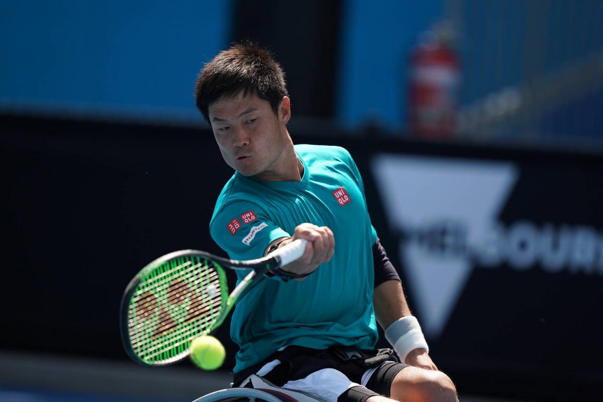male wheelchair tennis player Shingo Kunieda plays a forehand on a hard court