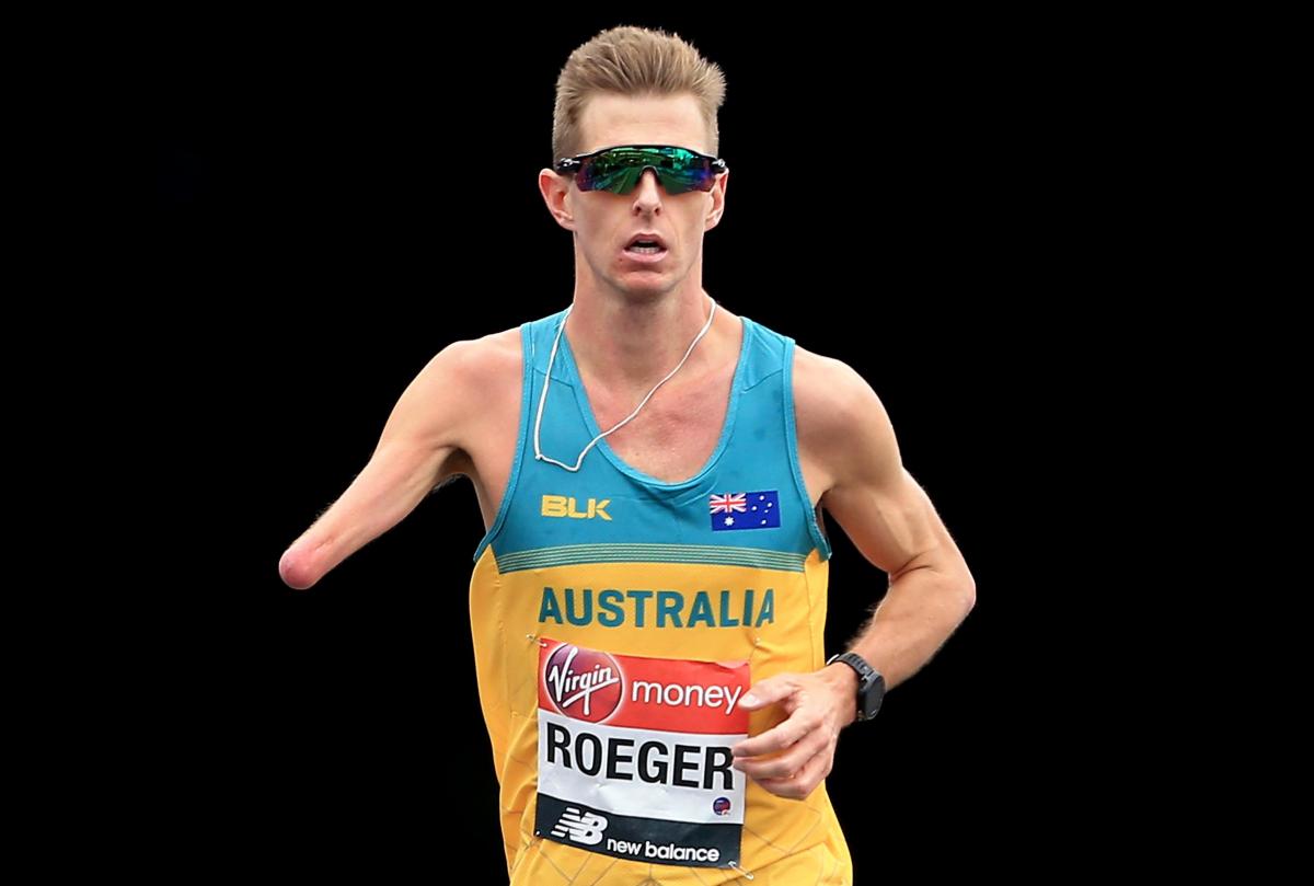 male Para athlete Michael Roeger running on the streets of London