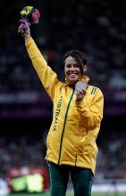 A picture of a woman celebrating her silver medal
