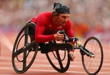 USA athlete leaning forward in his wheelchair on the track at London 2012