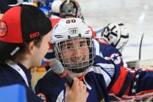 Josh Pauls, left, interviews teammate Adam Page during the first-ever IPC Ice Sledge Hockey Skills Challenge at Buffalo 2015.