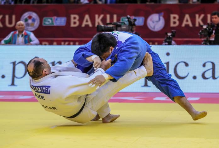 Two male judokas in action