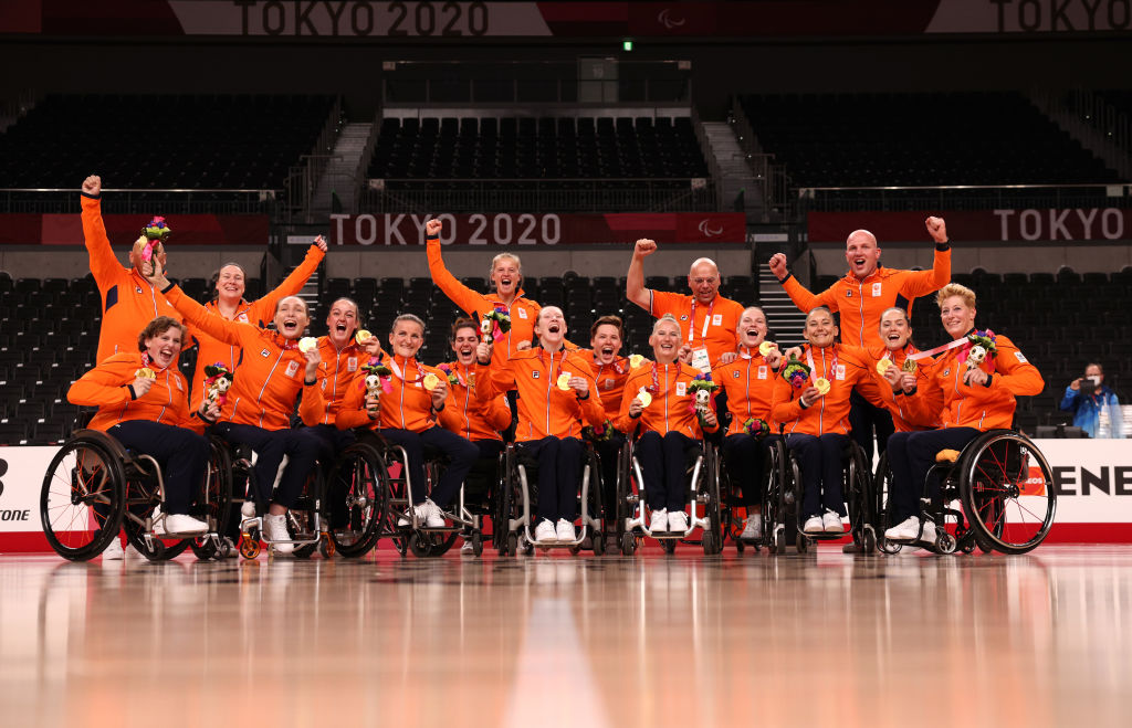 Netherlands players celebrate after winning gold in women's Wheelchair Basketball at the Tokyo 2020 Paralympic Games. 