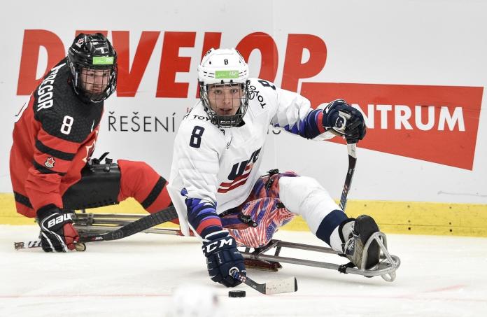 Two Para ice hockey players on the ice