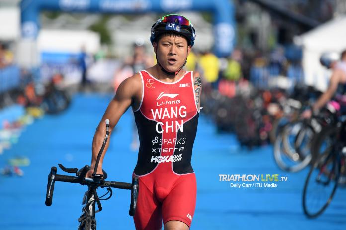Chinese male with left arm amputation transitions to bike segment of triathlon