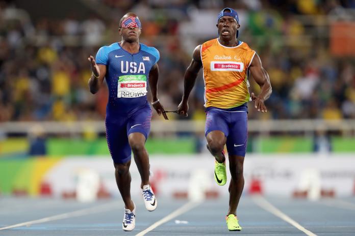 US athlete running alongside his guide