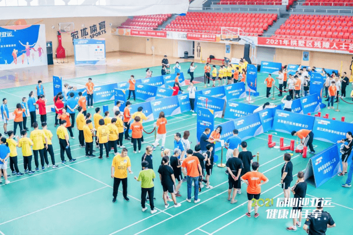 Sporting activities being held in indoor venue with many people attending
