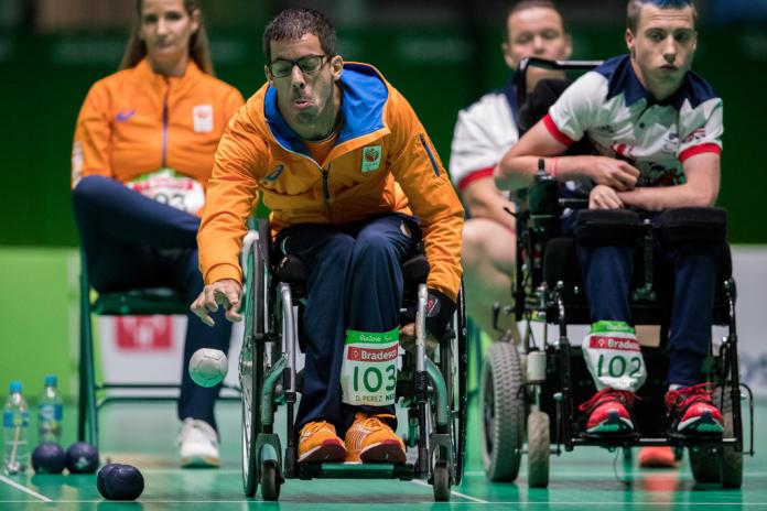 Two male boccia players face off