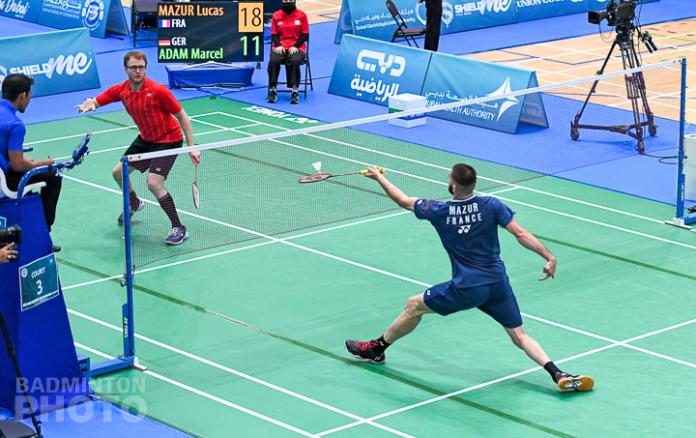 Two men lacking the upper arm compete in badminton