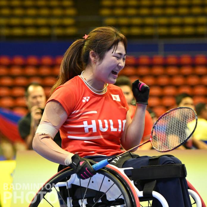 Japanese female wheelchair badminton player celebrates