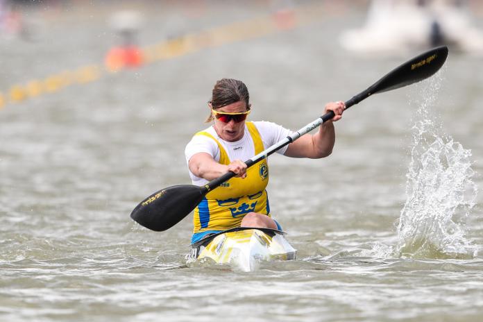 Woman paddles in kayak