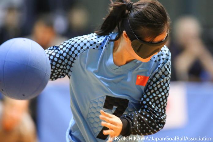 Chinese female goalball player about to throw the ball