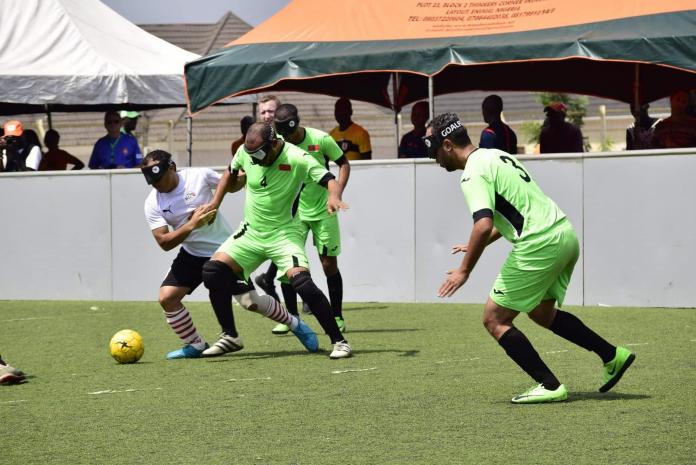 Moroccan and Egyptian football 5-a-side players fighting for the ball