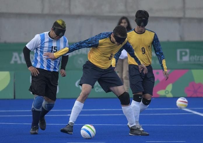 Brazilian and Argentinian soccer players fight for the ball