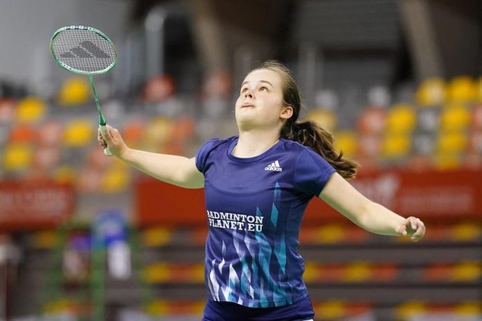 Dutch Para badminton player Sophie Van Den Brock holds her racket and looks upwards during a game