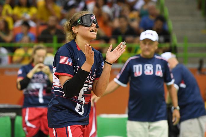 Femail goalball player clap hands to celebrate 