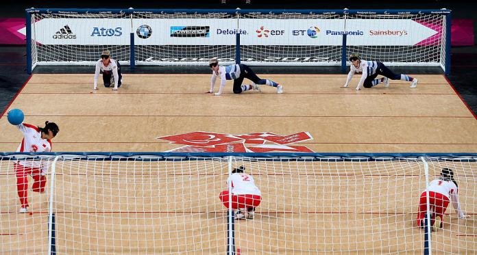 Wide shot of two teams facing each other in goalball