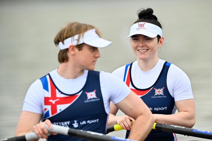 Double sculls crew with man and woman on boat