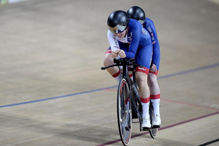 Female tandem bike in velodrome