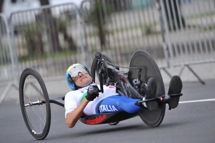 Man riding a hand cycle
