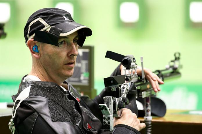 Man holds rifle