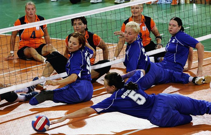 Woman dives trying to save volleyball 