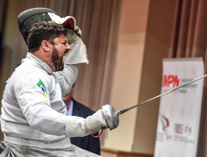 Brazilian wheelahcir fencer Jovane Guissone screams in celebration