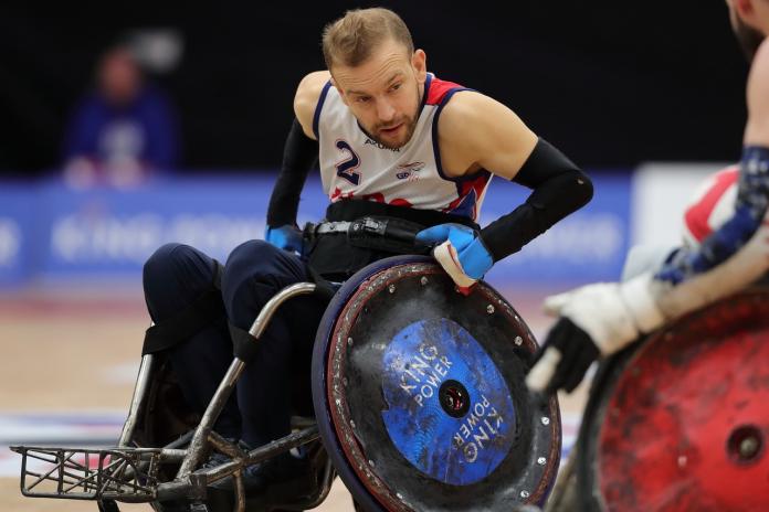 British wheelchair rugby player Johnny Coggan in action