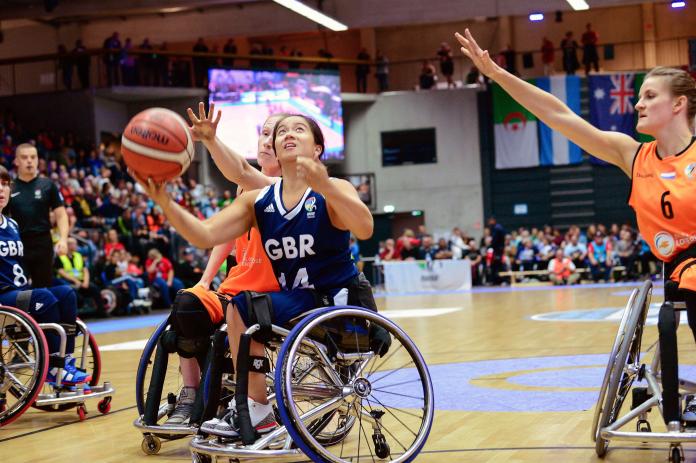 Dutch defenders trying to prevent Joy Haizelden from shooting