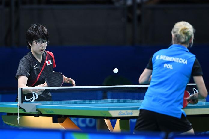 Two women with an intellectual impairment compete in table tennis