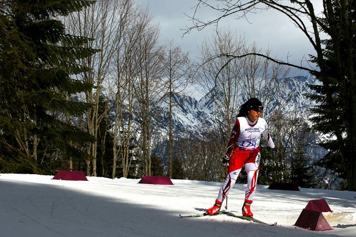 Woman competes in cross country skiing