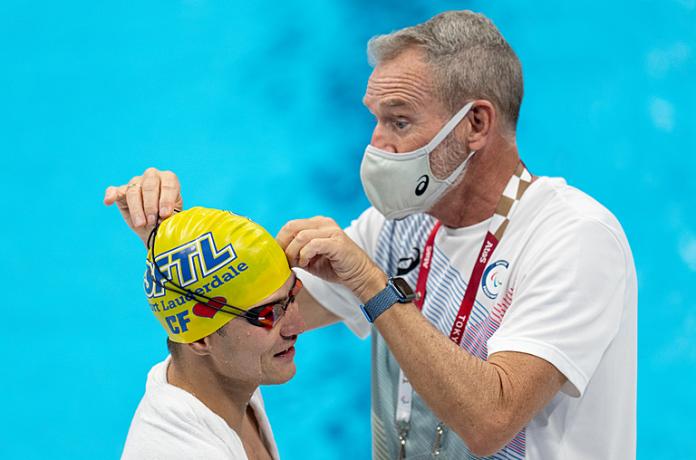  Abbas Karimi gets help with his goggles from Martin Hendrick 