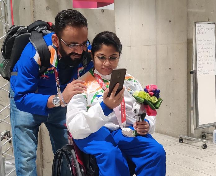 PARTNER IN CRIME: Bhavina Patel and her husband Nikul Patel talking to their families following her silver medal winning perfromance at Tokyo.
