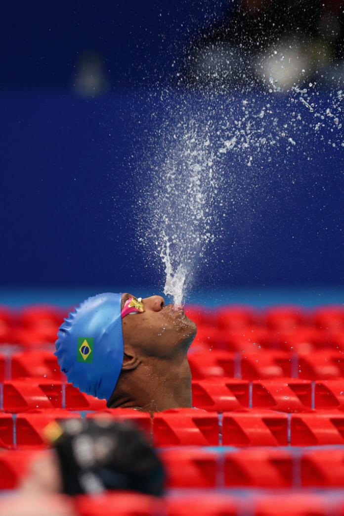 Man spouts water out of mouth