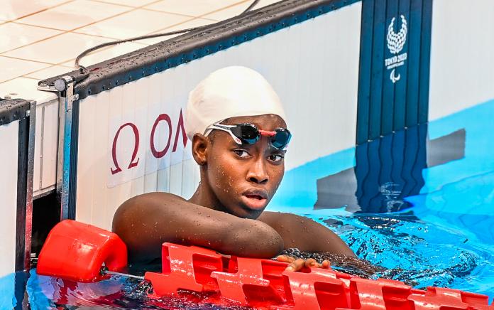Husnah Kukundakwe in the pool following her race at Tokyo 2020