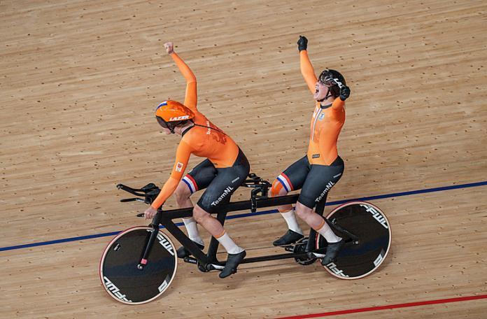 Dutch cyclist Larissa Klaassen and pilot Imke Brommer celebrate after winning the women's B 1,000m time trial at the Izu Velodrome